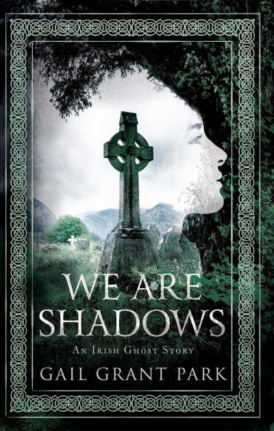 celtic cross in center of a woman's shadowy face outlines by a tree